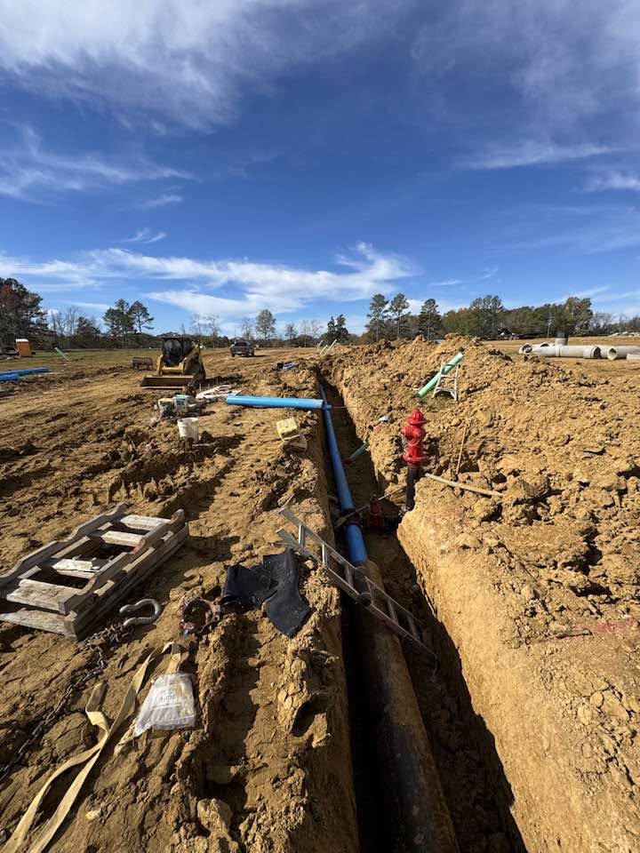 Pipe installation in an open utility trench